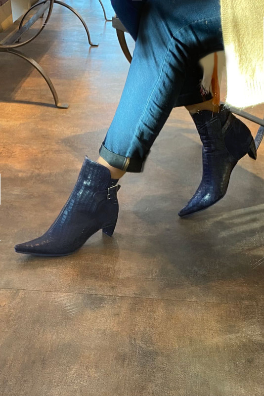 Navy blue women's ankle boots with buckles at the back. Pointed toe. Medium comma heels. Worn view - Florence KOOIJMAN